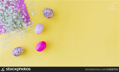set pink easter eggs near flowers napkin