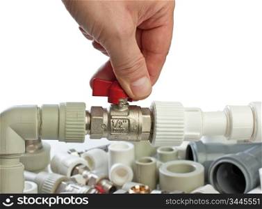Set plumbing fittings in his hand isolated on white background