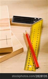 set-square ruler and pencil with boards