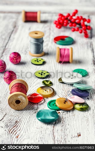 Set thread,buttons,beads on the table light vintage