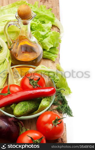 Set vegetable and jug of vegetable oil isolated on the white background