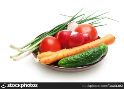 Set vegetables on the plate isolated on a white background
