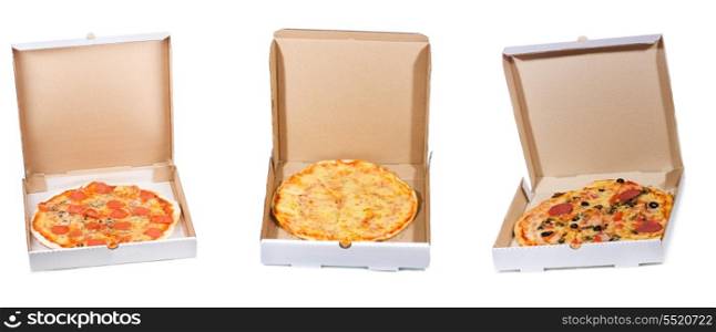 set with different pizza in open paper box on white background