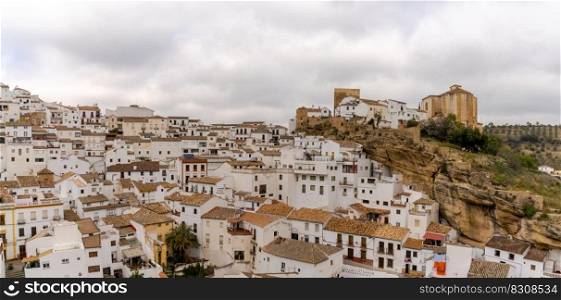 Setenil de las Bodegas, Spain - 19 February, 2022: panorama view of the landmark town of Setenil de las Bodegas in Andalusia