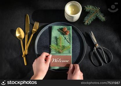 Setting A Holiday Dinner Table on Black Background