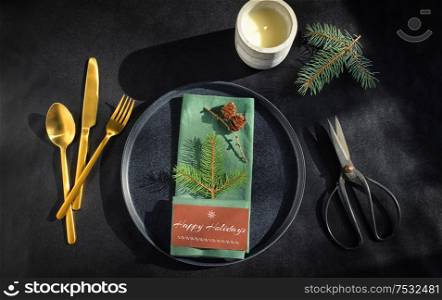 Setting A Holiday Dinner Table on Black Background