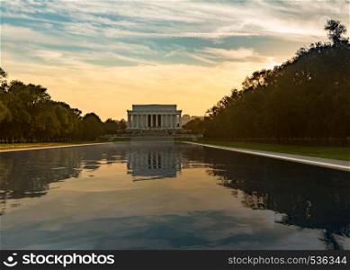 Setting sun illuminates Lincoln Memorial in Washington DC with reflections in new Reflecting Pool. Setting sun on Lincoln memorial reflecting