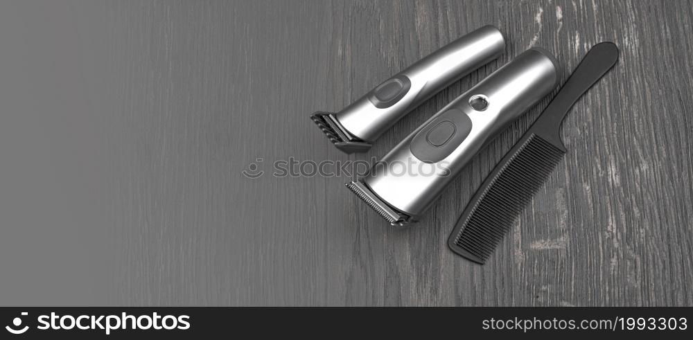 Setting with hair clipper and comb on wooden background with copy space