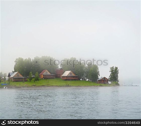 settlement on lake island in fog