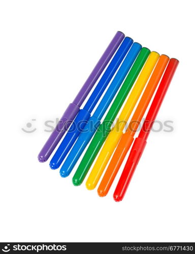 Seven felt pens lie in a row, isolated on white background, top view, studio shot, high depth of field