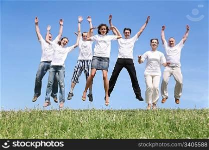 Seven friends in white T-shorts are in a jump