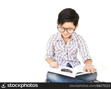 Seven year old Asian boy is reading a book excitedly isolated over white
