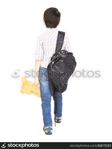 Seven year old Asian boy with a bag is ready to go to school isolated over white