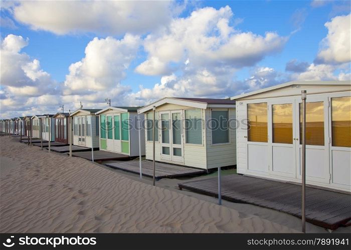 Several beachhouses in a row on beach in The Netherlands