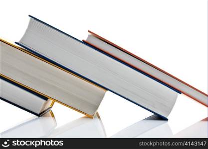 several books are lying on a white background
