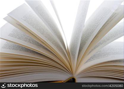 several books lie open on a white background