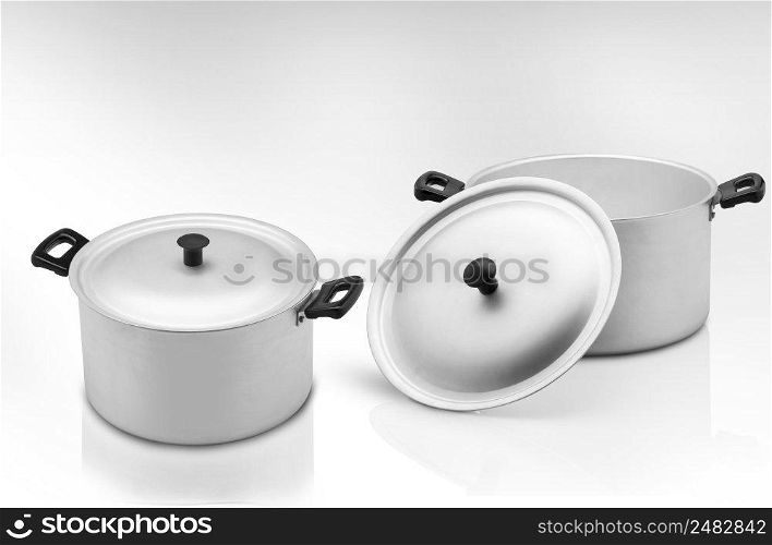 several cooking pots on a light background. kitchen pan on a light background