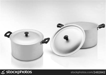 several cooking pots on a light background. kitchen pan on a light background