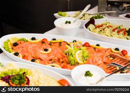 Several dishes with various salads in buffet restaurant