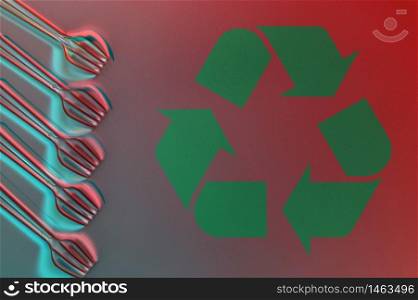 Several disposable plastic forks and recycling sing on a bright background. Minimalistic ecologically clean still life. Green technology and ecology problem concept.. Disposable plastic forks and recycling sing on a bright background. Minimalistic ecologically clean still life. Green technology and ecology problem concept.