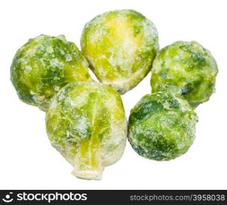 several frozen Brussels sprouts isolated on white background
