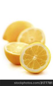Several lemon halves isolated on white background