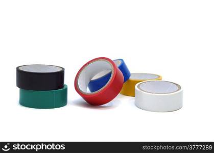 Several multi-colored spools of tape