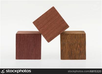 Several old cubes of wood, used by children for building (tropical wood)