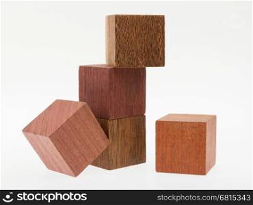 Several old cubes of wood, used by children for building (tropical wood)