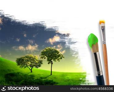 several paintbrushes and nature landscape on the background