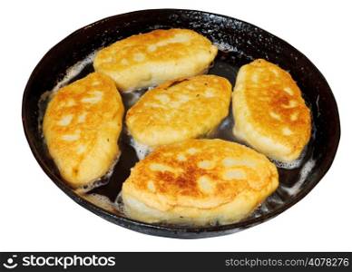 several patties with spring onion and eggs in frying pan isolated on white background