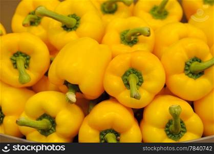 Several pods of yellow sweet pepper, capsicum