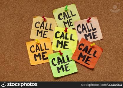 several sticky notes on cork bulletin board with reminder - call me