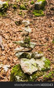 Several stones in equilibrium, pile of rocks in the forest in Autumn