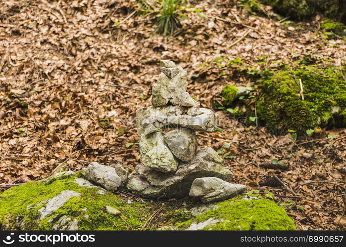 Several stones in equilibrium, pile of rocks in the forest in Autumn