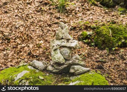 Several stones in equilibrium, pile of rocks in the forest in Autumn