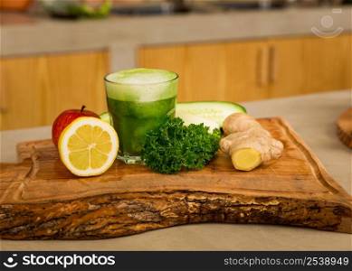 Several vegetables on top of a wooden board. Ingredients for detox juice.