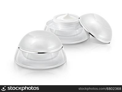 Several white rounded cosmetic jar on white background
