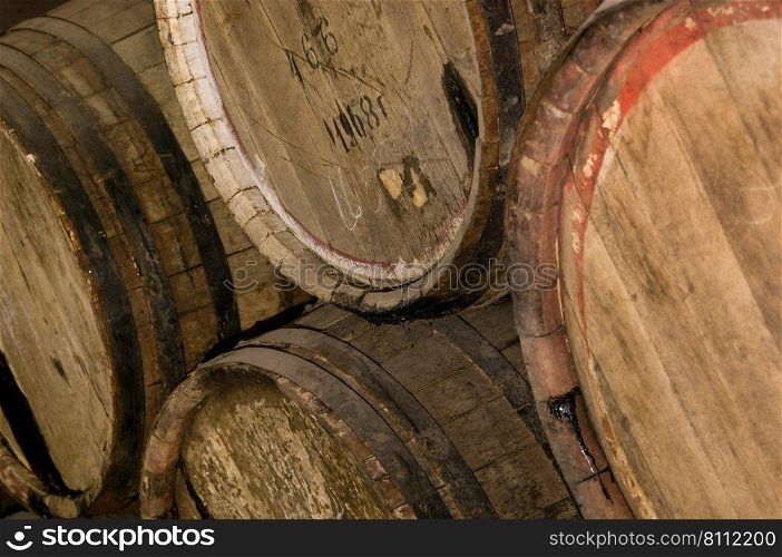 Several wooden barrels with wine closeup. wooden wine barrels