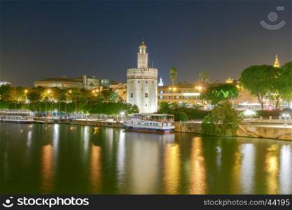 Sevilla. Golden Tower at night.. Night view of the Golden Tower on the waterfront of the Guadalquivir. Sevilla. Andalusia.