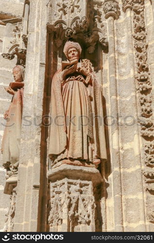 Sevilla. Sculptures on Cathedral.. Stone carving and sculptures on the walls of the cathedral in Seville.