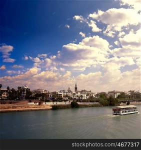 Seville skyline and Alfonso XIII channel river Andalusia Spain
