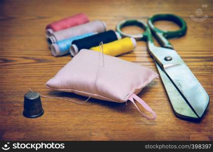 Sewing accessories on wooden table