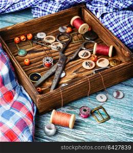 Sewing buttons and spools of thread. Sewing kit from sewing thread, buttons and fabric.Sewing concept