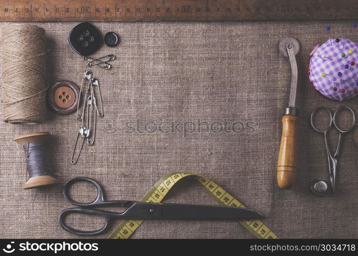 Sewing instruments, threads, needles, bobbins and materials.. Sewing instruments, threads, needles, bobbins and materials. Studio photo