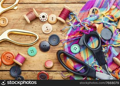 Sewing kit of threads, buttons and fabric.Accessories for sewing and needlework. Fabrics and sewing tools