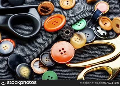 Sewing kit of threads, buttons and fabric.Accessories for sewing and needlework. Fabrics and sewing tools