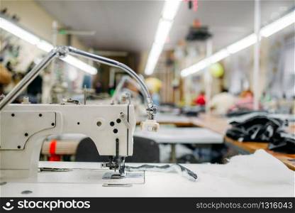 Sewing machine on clothing fabric, nobody. Dressmaking industry, Equipment on dress factory, professional tailoring
