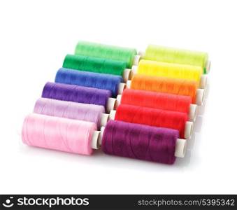 Sewing multicolored threads isolated on white