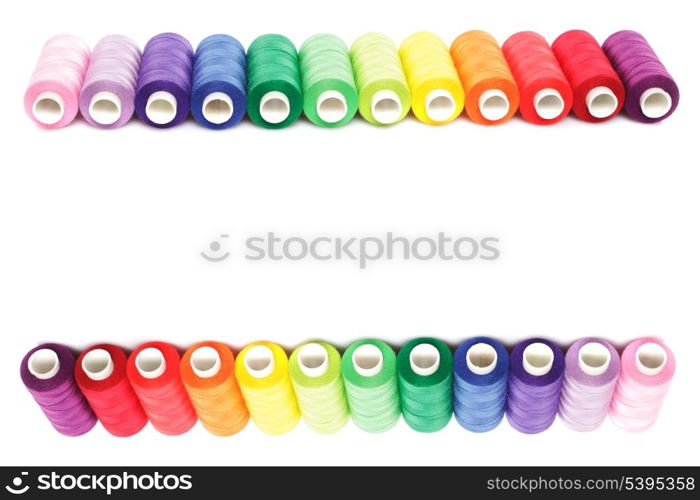 Sewing multicolored threads isolated on white